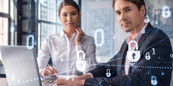 Businessman and businesswoman working together to protect clients confidential information and cyber security. IT hologram padlock icons over office background with panoramic windows.