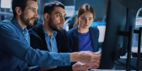 Industry 4.0 Modern Factory: Team of Innovative Industrial Engineers Use Computer and 3D Printer to Build Complex Component. Group of Scientists Use High-Tech Machinery for Futuristic Design